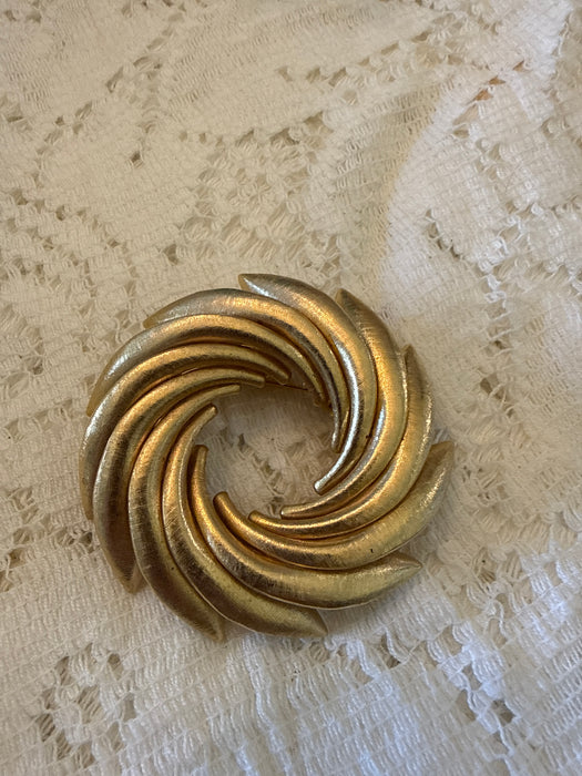 Vintage gold tone swirled pinwheel brooches