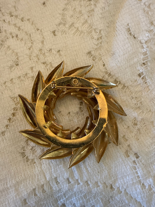 Vintage gold tone swirled pinwheel brooches