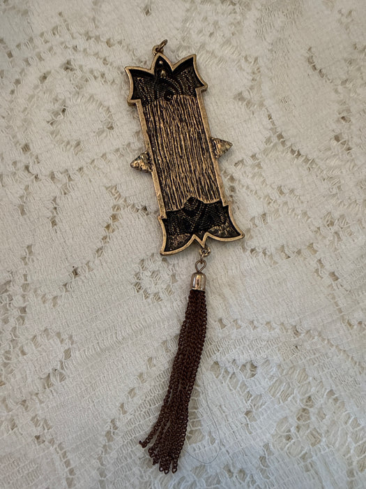 Metal banner charm with tassel
