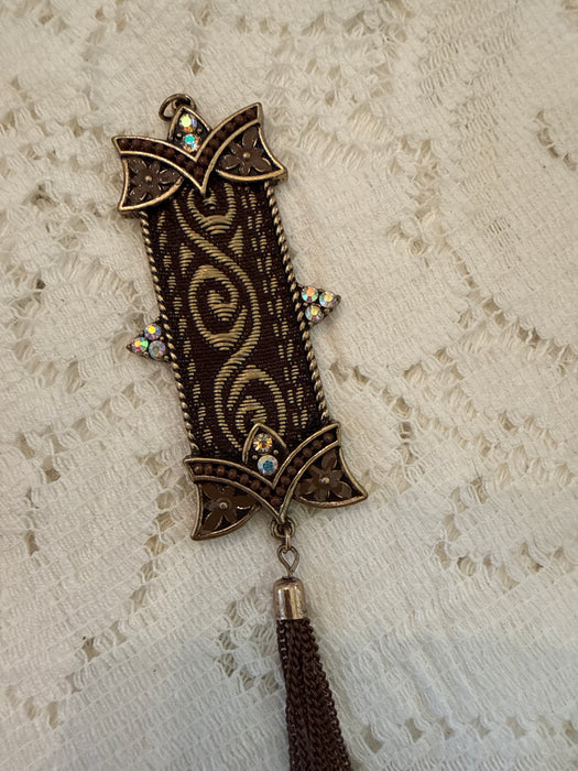 Metal banner charm with tassel
